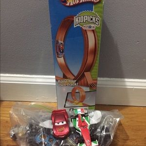 Racetrack with hot wheels and play cars